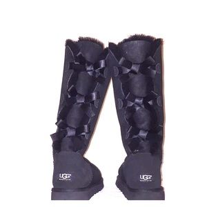 Long black ugg boots with bows on the back